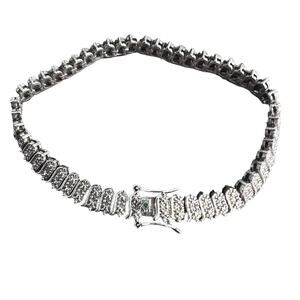 Textured silver tone vintage inspired tennis bracelet with an open box clasp